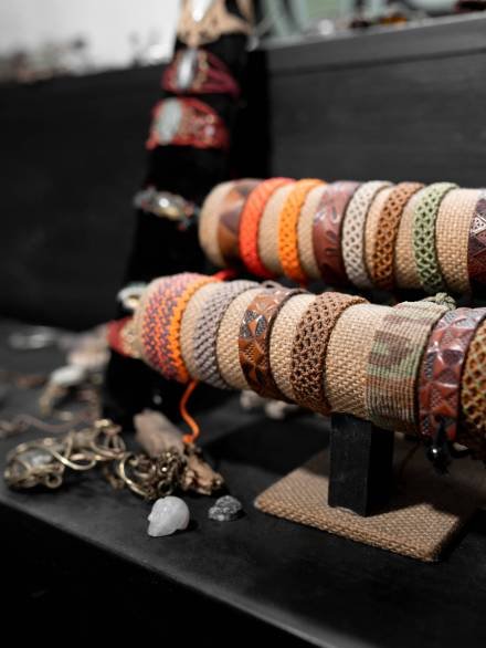 A collection of colorful leather bracelets are being exhibited in a jewelry. Concept of craft work